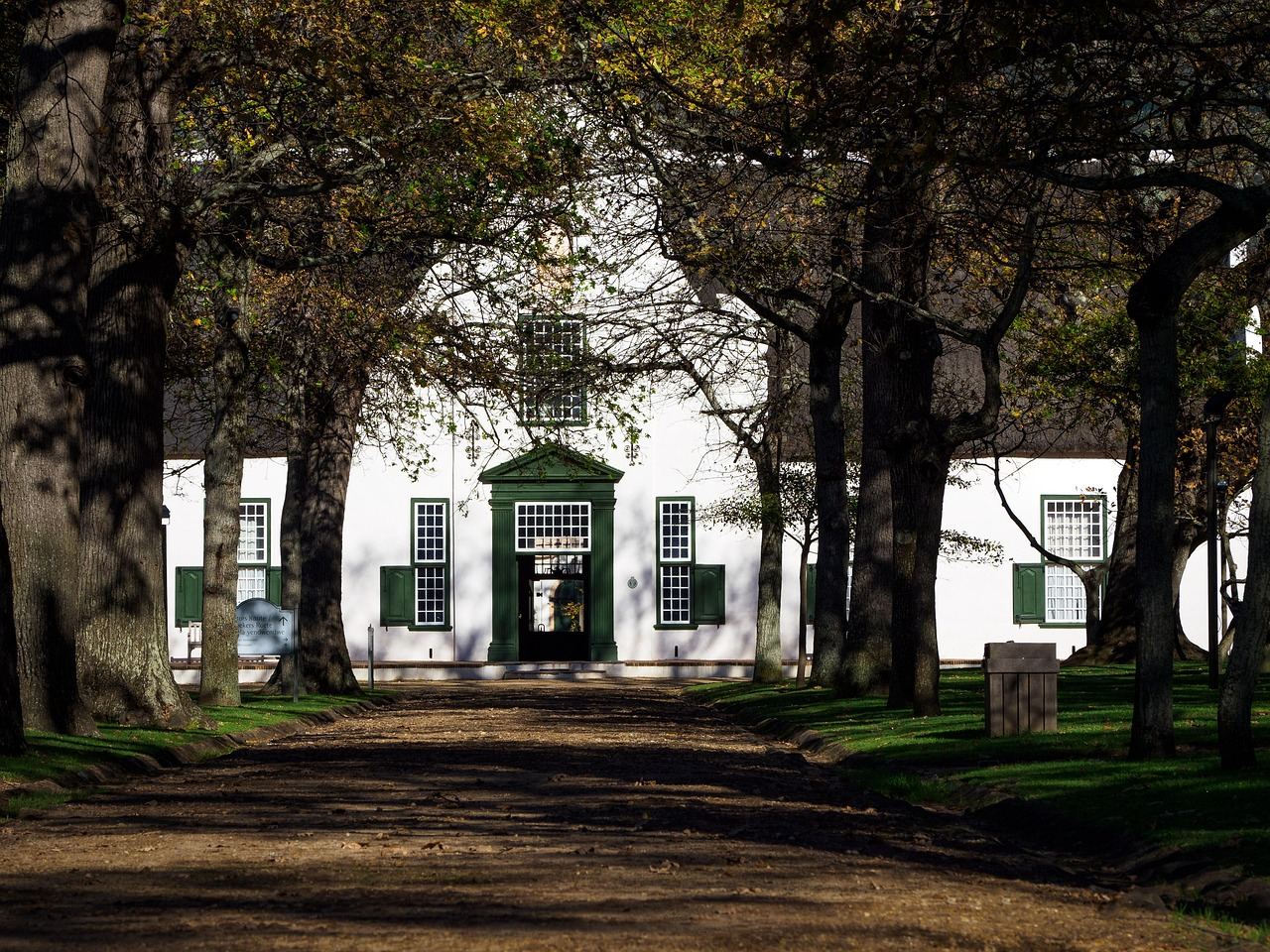 Historic Cape Dutch manor house and tree-lined grounds at Groot Constantia in Cape Town